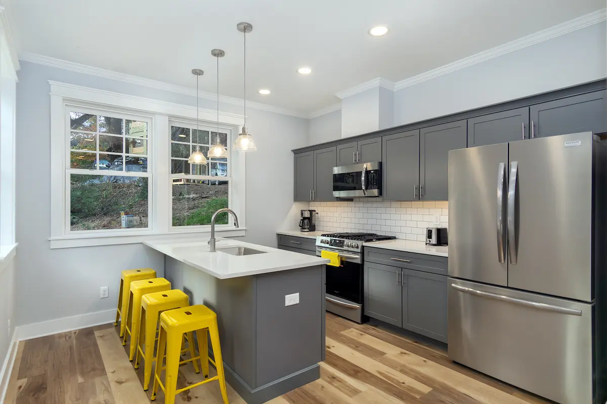 Sleek modern bathroom renovation in Asheville NC featuring energy-efficient fixtures and clean design.